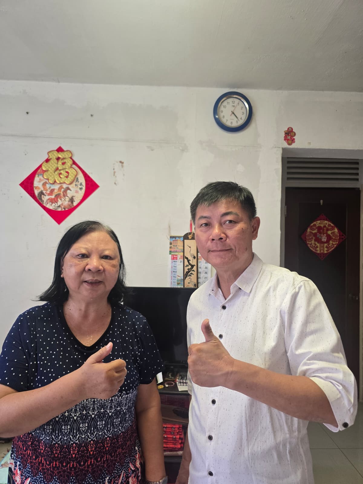 Jason from A1 Electrician SG with a happy customer in their Singapore home (3)